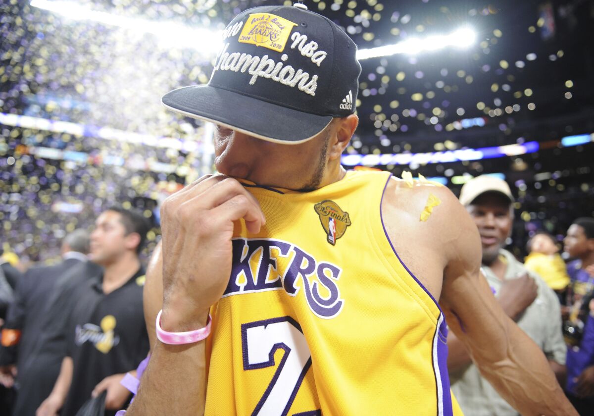 Derek Fisher kisses his Lakers jersey after the team's win over the Boston Celtics in Game 7 of the 2010 NBA Finals.