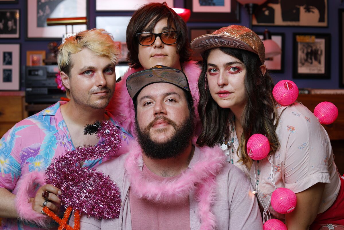 Clockwise from left, Zak Kmak, Jenny Merullo, Shelbi Bennett, and Josh Smith of the "pink punk" band, The Havnauts.