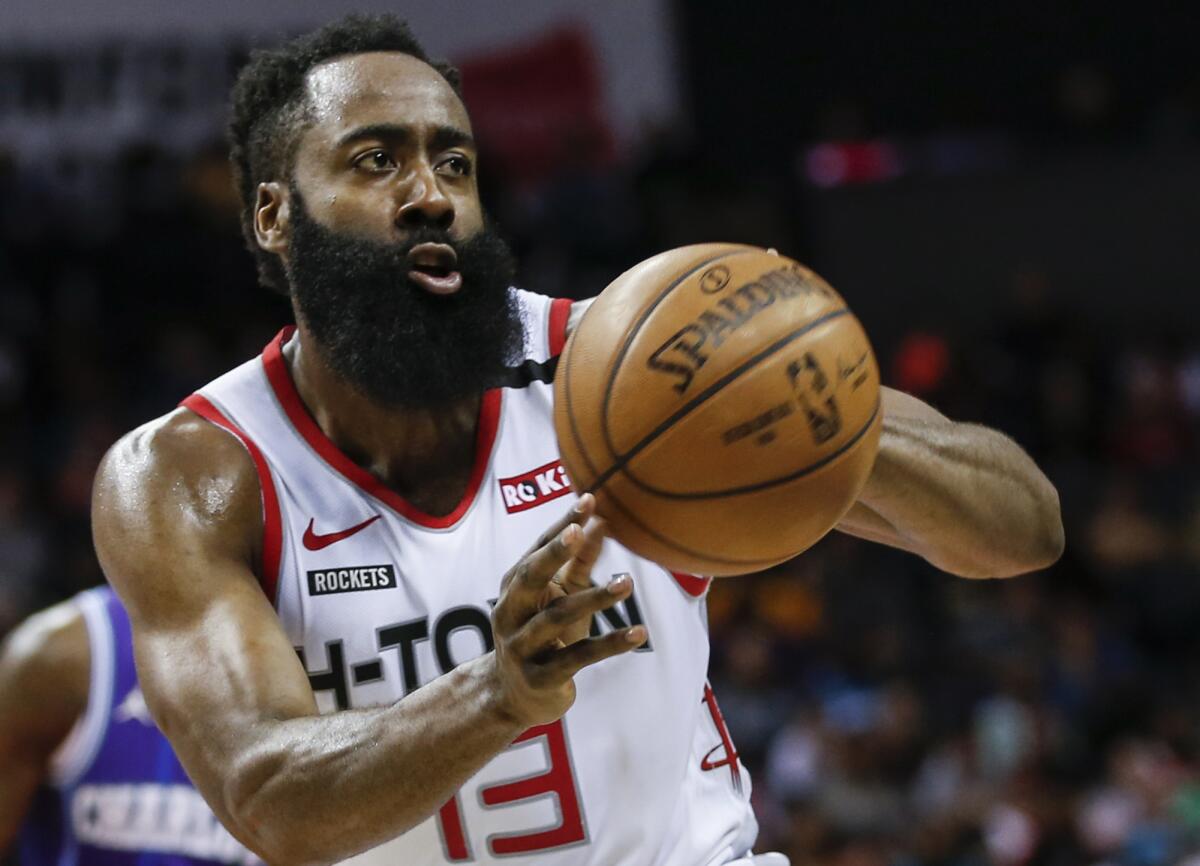 Rockets guard James Harden passes during a game against the Hornets on March 7, 2020, in Charlotte.