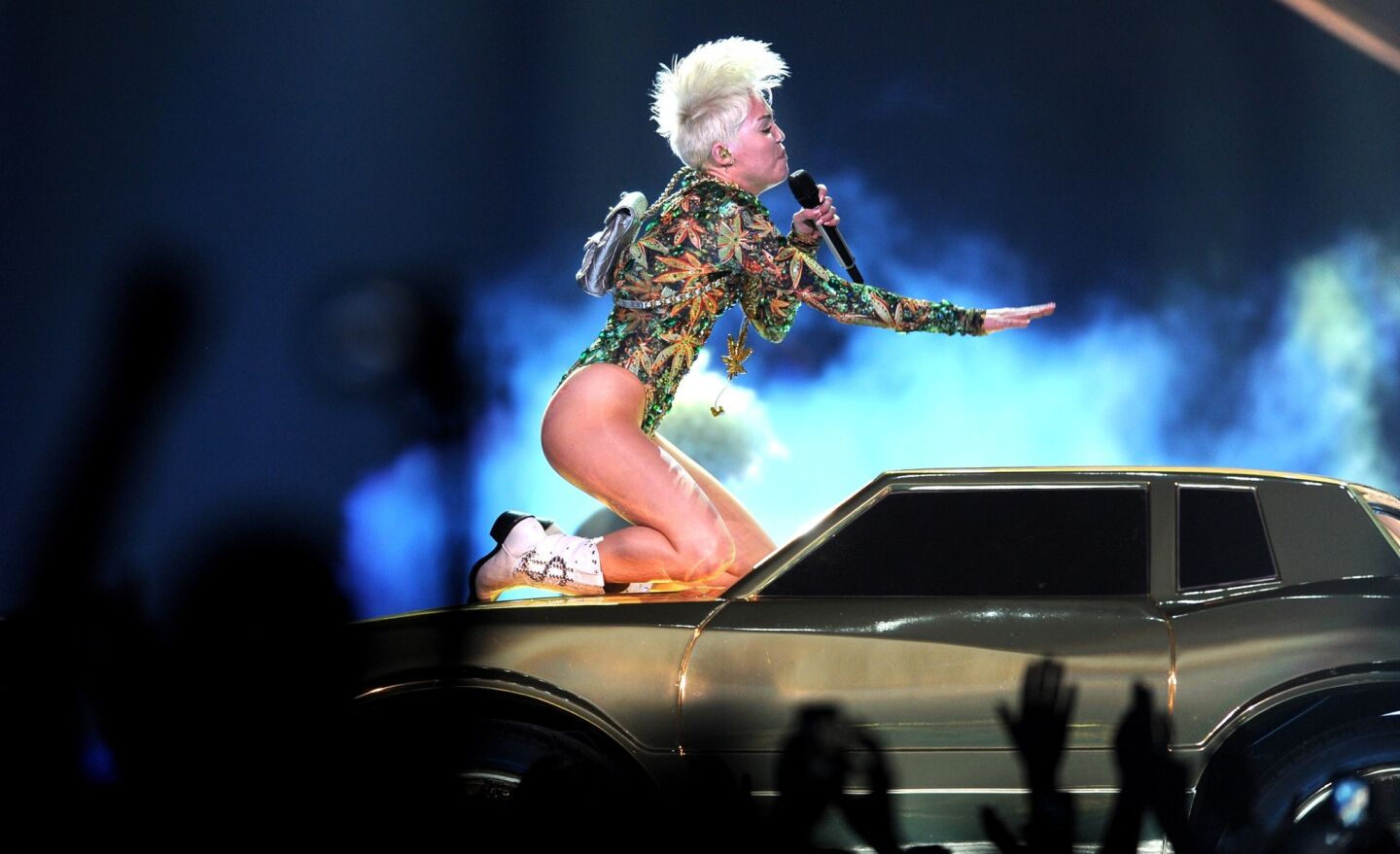 With a swing, Miley Cyrus' hair gives off a Mohawk effect.