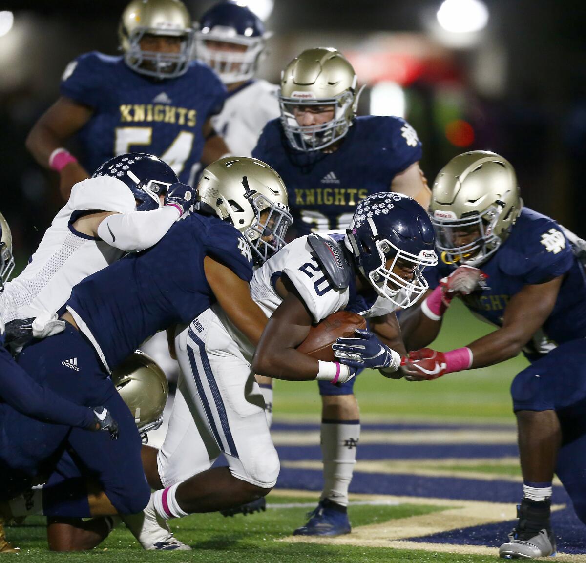 Loyola running back Tahj Owens grinds out tough yardage against Notre Dame during the third  quarter Friday night.