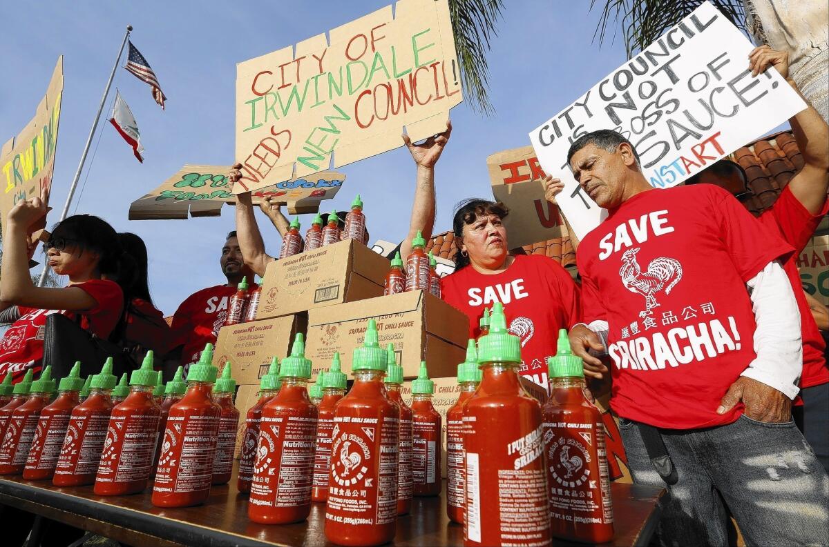 Sriracha hot sauce workers protest before the start of the Irwindale City council meeting. The council previously drafted a resolution declaring Sriracha a public nuisance because of the burning smell coming from its plant.