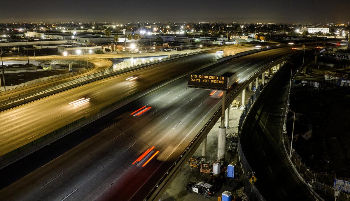  Vehicles use the 10 Freeway as it reopens in downtown L.A. after weeklong closure