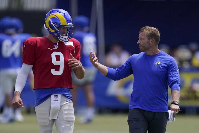 Los Angeles Rams head coach Sean McVay, right, speaks with quarterback Matthew Stafford during an NFL football practice Saturday, July 30, 2022, in Irvine, Calif. (AP Photo/Mark J. Terrill)