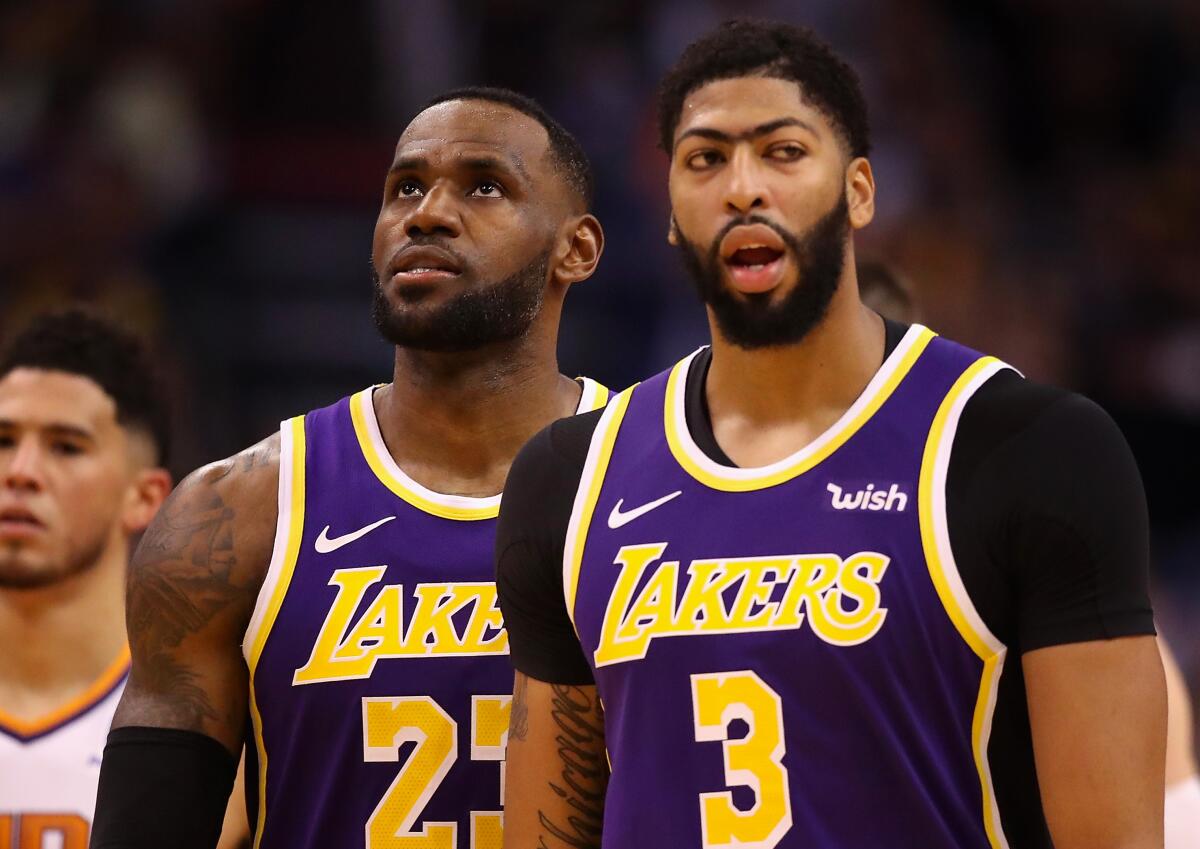 Lakers forward LeBron James chose teammate Anthony Davis (3) with the first pick in the All-Star game draft on Thursday.