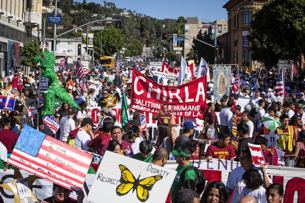 On the same day that demonstrators filled the streets at Hollywood Boulevard and Western Avenue -- as well as other places around the U.S. -- Gov. Brown signed bills to protect those in the country illegally.