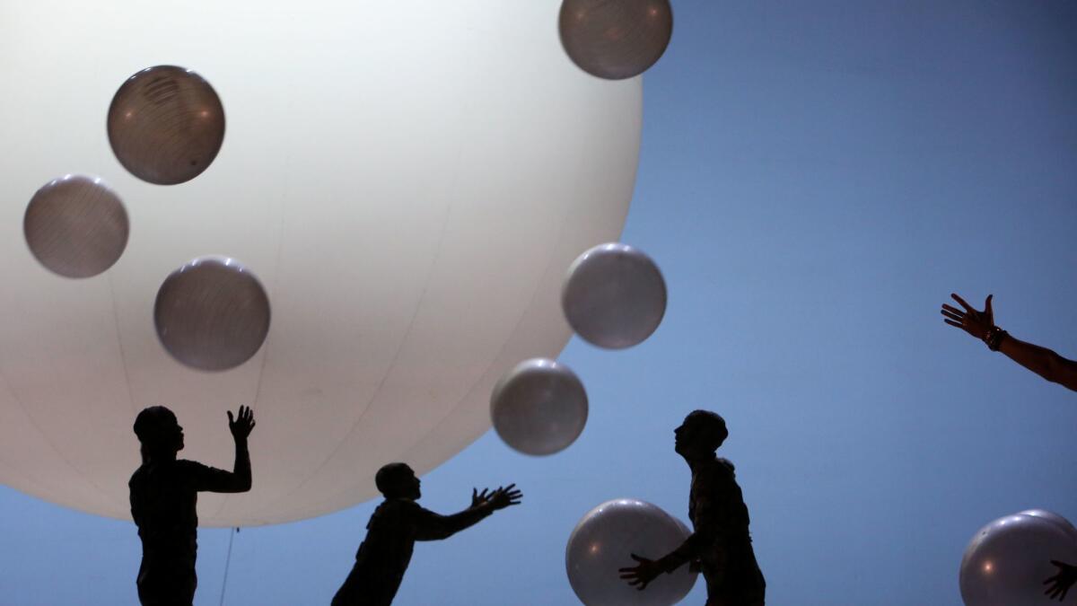 Jugglers appear through the three acts of "Akhnaten," tossing, among other things, giant white balls with remarkable efficiency.