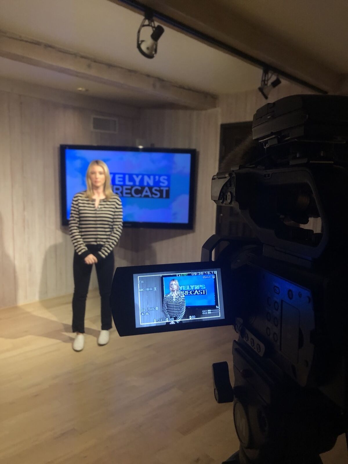 Meteorologist Evelyn Taft now forecasts the weather from home, using her television to display graphics and maps.