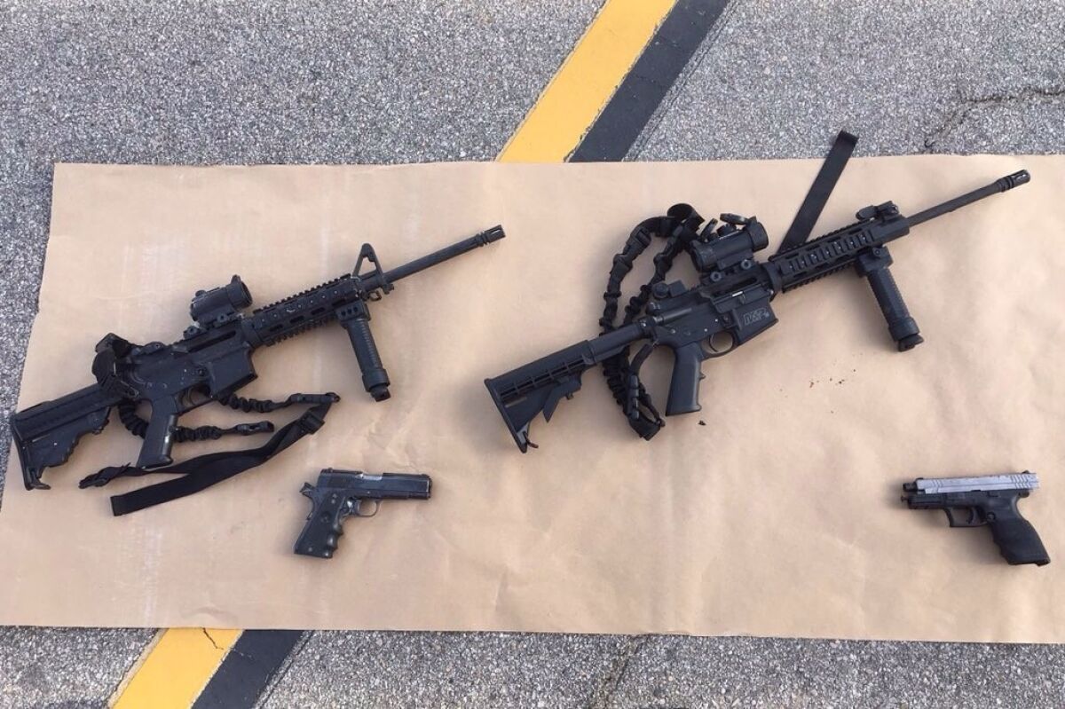 In this handout photo provided by the San Bernardino County Sherrif's Department, four guns are seen near the site of a Dec. 4 shootout between police and suspects in San Bernardino.