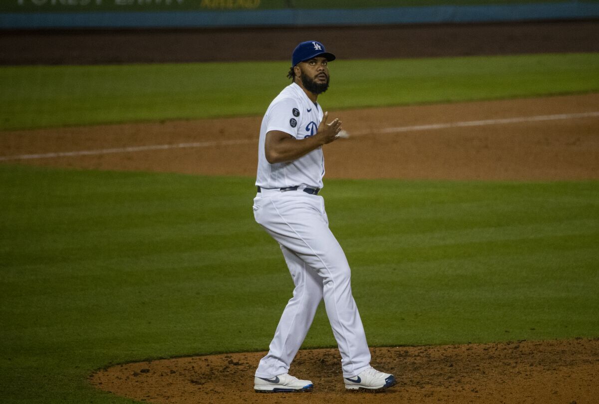 Dodgers closer Kenley Jansen beats his chest after getting the save in the Dodgers' 5-4 win over the San Diego Padres.