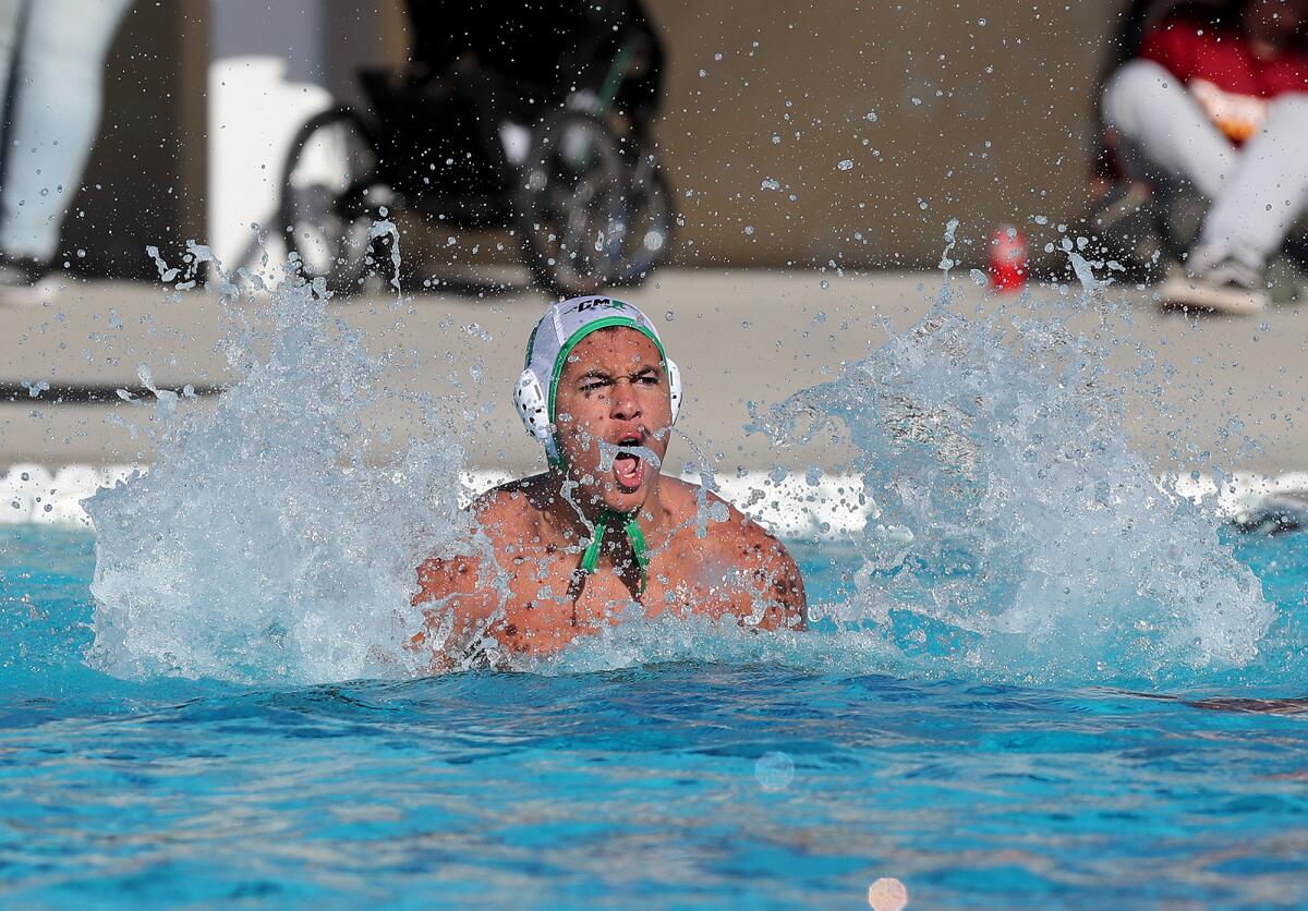Costa Mesa's Ayden Alcazar celebrates after scoring a penalty goal against Estancia.