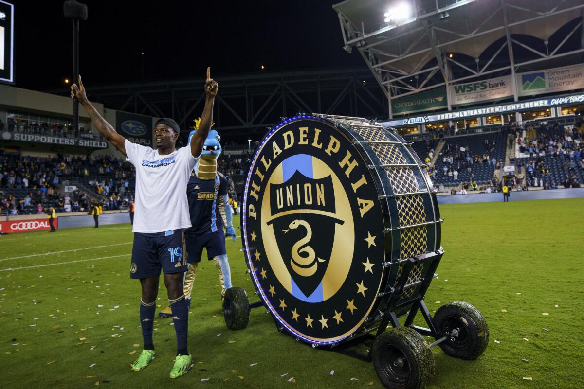 Philadelphia Union's Cory Burke reacts after hitting the drum following the second half of an MLS soccer match against New York City FC, Sunday, Oct. 30, 2022, in Chester, Pa. The Union won 3-1 and clinched the MLS Eastern Conference title. (AP Photo/Chris Szagola)