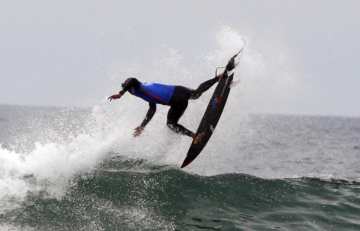 Kanoa Igarashi of Huntington Beach gets air during his men's semifinal heat of the 2021 U.S. Open of Surfing on Sunday.
