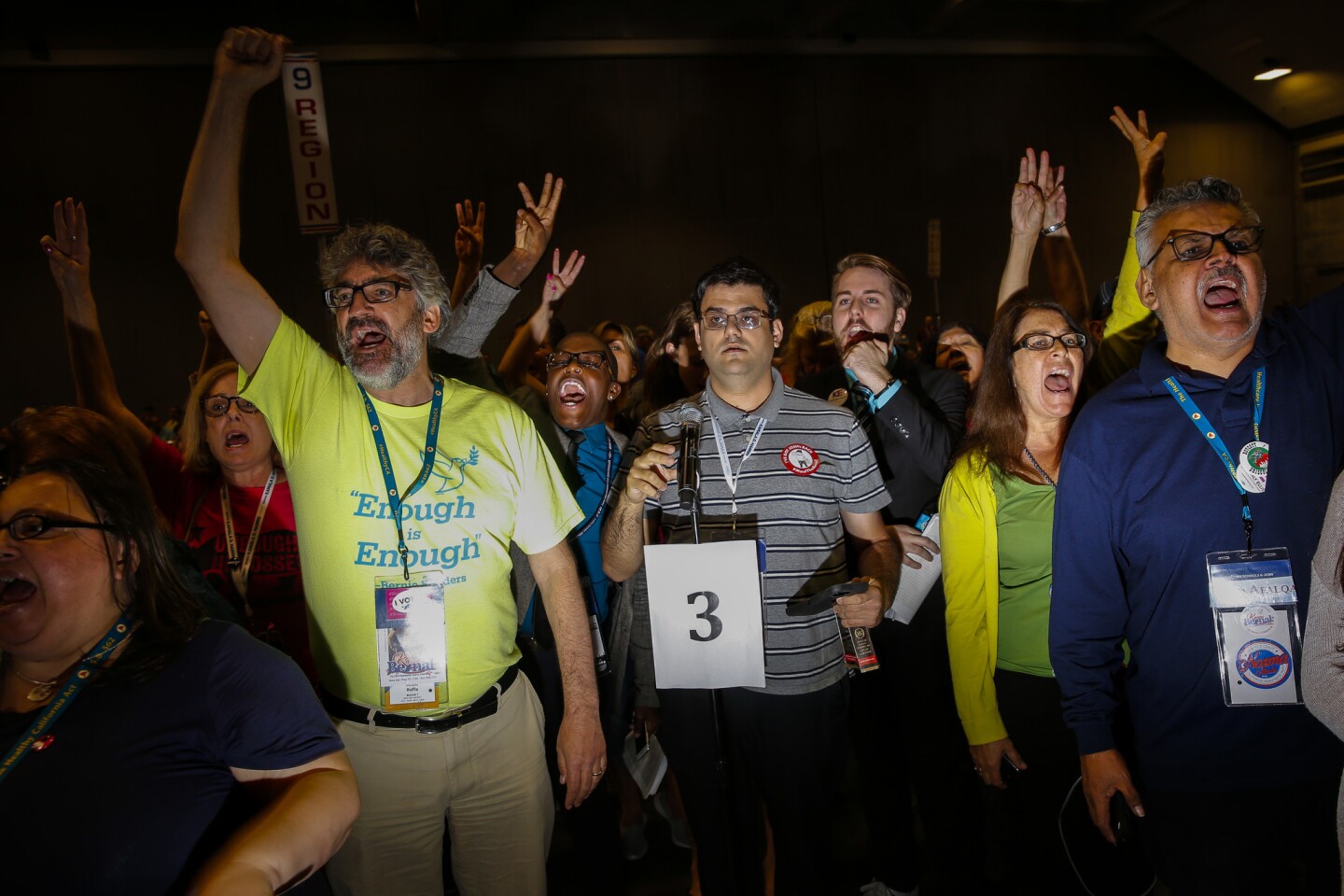 Delegates who supported Kimberly Ellis in the race for party chief chant for an opportunity to speak during a contentious discussion about the election results on the final day of the California Democratic Party Convention at the convention center in downtown Sacramento.