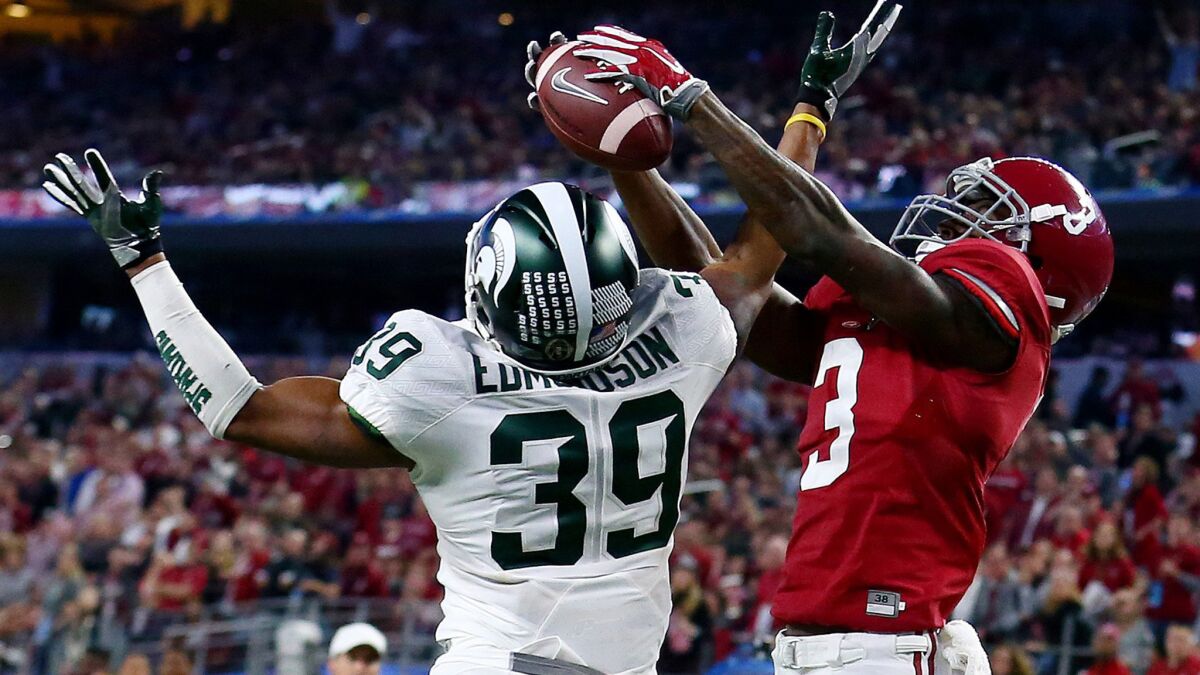 Alabama receiver Calvin Ridley (3) catches a six-yard touchdown pass against Michigan State cornerback Jermaine Edmondson in the Cotton Bowl on Dec. 31, 2015.