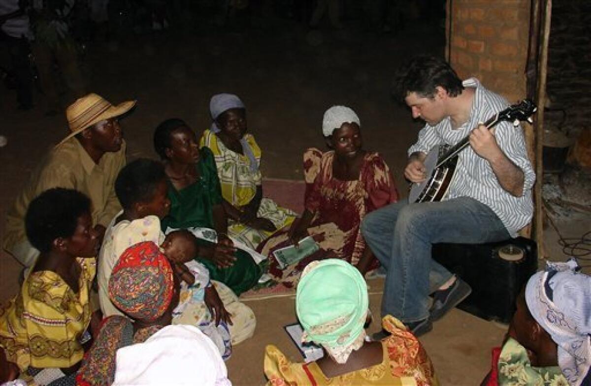 Banjo virtuoso Bela Fleck is shown performing for the Nakisenyi Women's Group in Uganda.  His 2008 film and album, "Throw Down Your Heart," chronicled Fleck's journey to Uganda, Tanzania, Gambia and Mali to visit and play music with local artists.