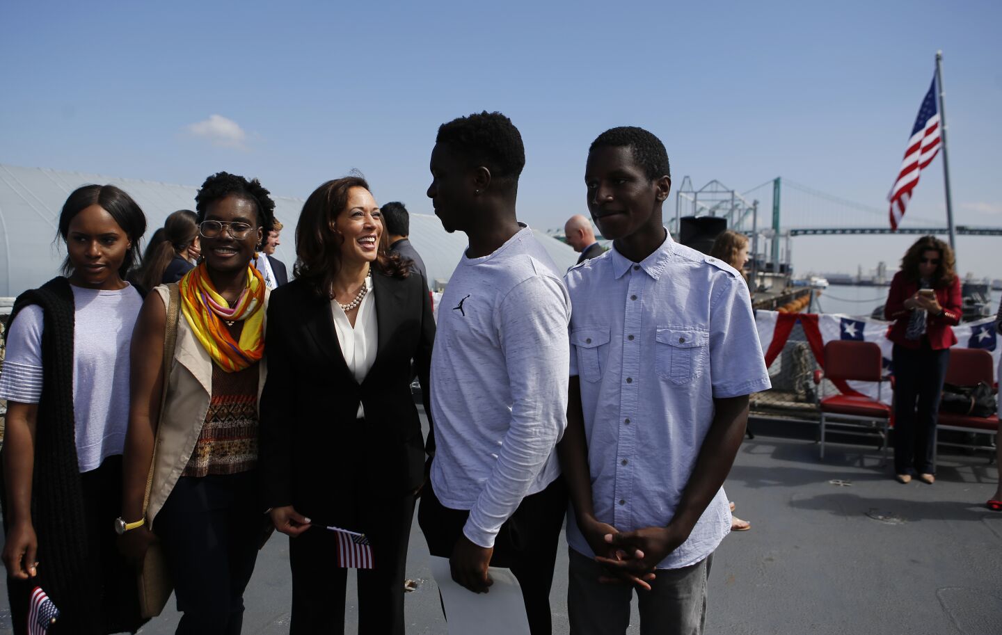 Kamala Harris greets people who were sworn in as citizens in a ceremony on the battleship Iowa in Los Angeles in 2017.