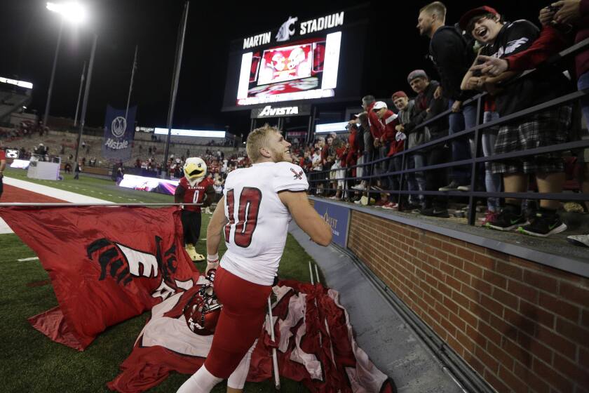 Eastern Washington wide receiver Cooper Kupp (10) celebrates with fans after winning an NCAA college football game in 2016.