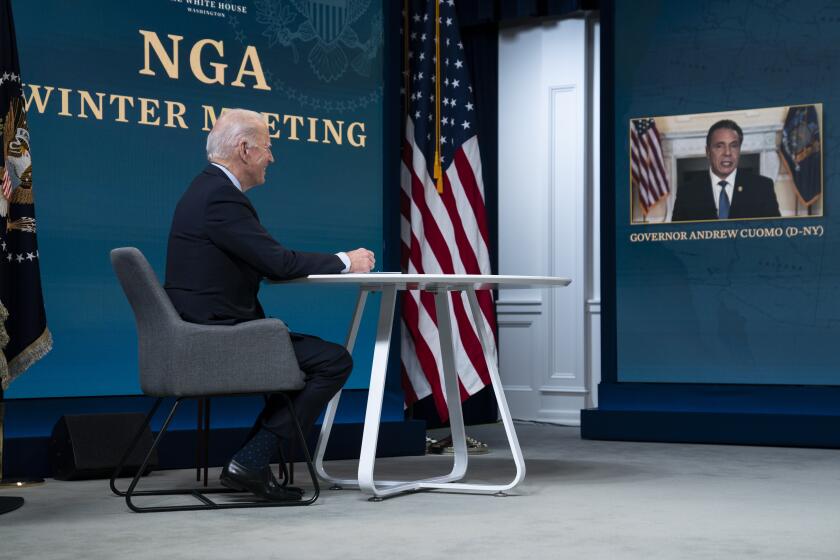 In this Feb. 25, 2021, photo, President Joe Biden listens as Gov. Andrew Cuomo, D-N.Y., speaks during a virtual meeting of the National Governors Association, in the South Court Auditorium on the White House campus in Washington. The Democratic governor is struggling through a sexual harassment scandal that’s testing the limits of his party’s support as Democrats grapple with their first political crisis of the post-Trump era.(AP Photo/Evan Vucci)