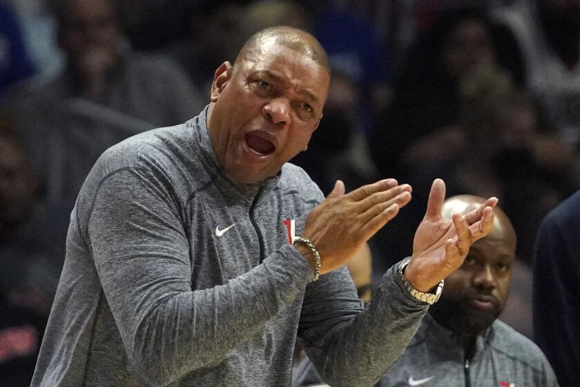 Philadelphia 76ers head coach Doc Rivers gestures to referees during the first half of an NBA basketball game against the Los Angeles Clippers Friday, March 25, 2022, in Los Angeles. (AP Photo/Mark J. Terrill)