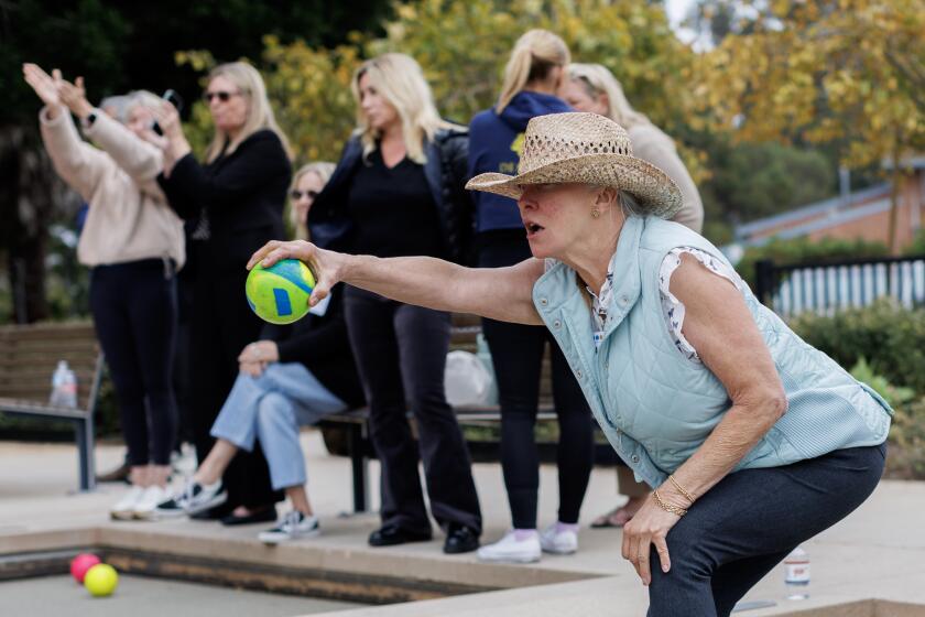 PACIFIC PALISADES, CA - MAY 28, 2024: Nancy Myers of the "I Liff Bocce" team lines up her ball during play for the Pacific Palisades Bocce League on May 28, 2024 in Pacific Palisades, California. (Gina Ferazzi / Los Angeles Times)