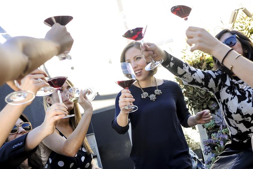 Elizabeth Huettinger, wine director at Otium restaurant, center, hosts a gathering of sommeliers and friends at her apartment building, the newly completed Emerson in downtown L.A.