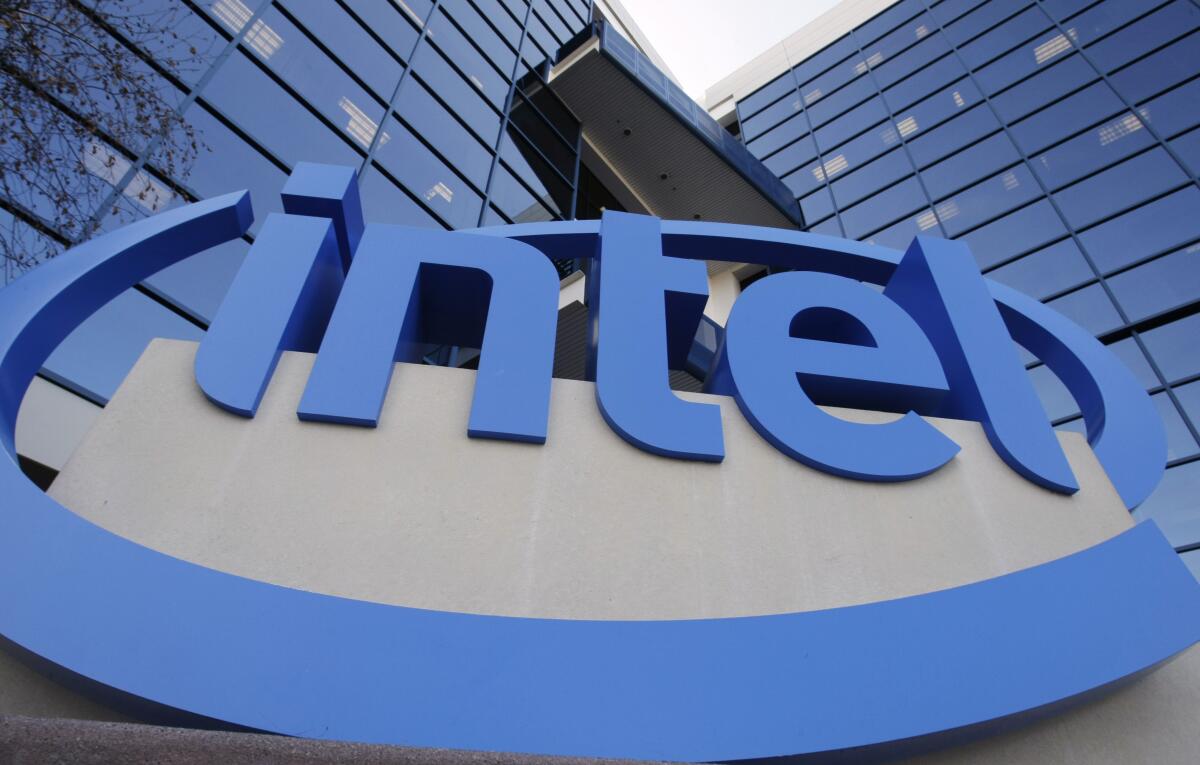 The Intel logo is displayed outside the entrance of the company's headquarters in Santa Clara, Calif.