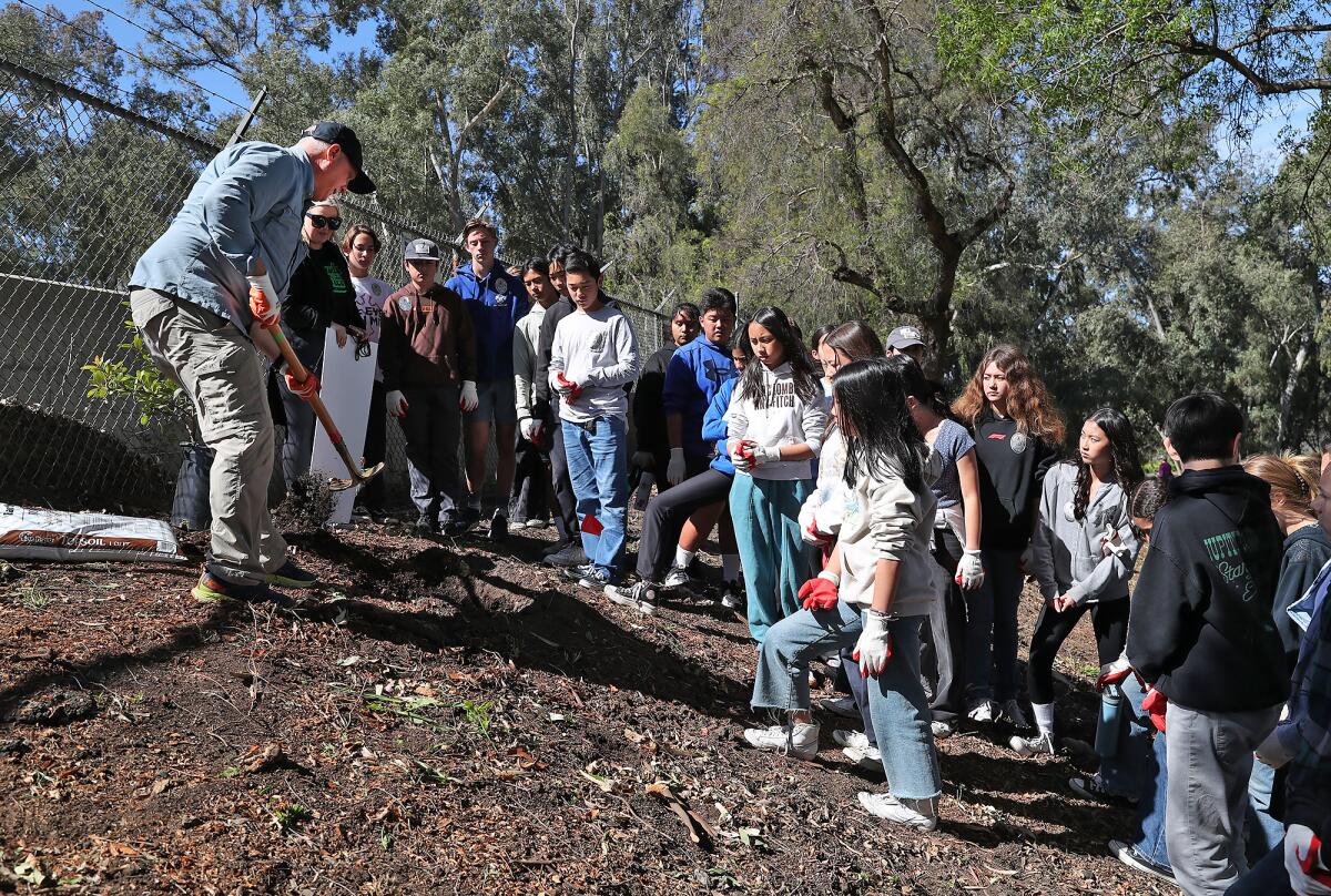 Students listen to John King, a volunteer from Huntington Beach Tree Society.