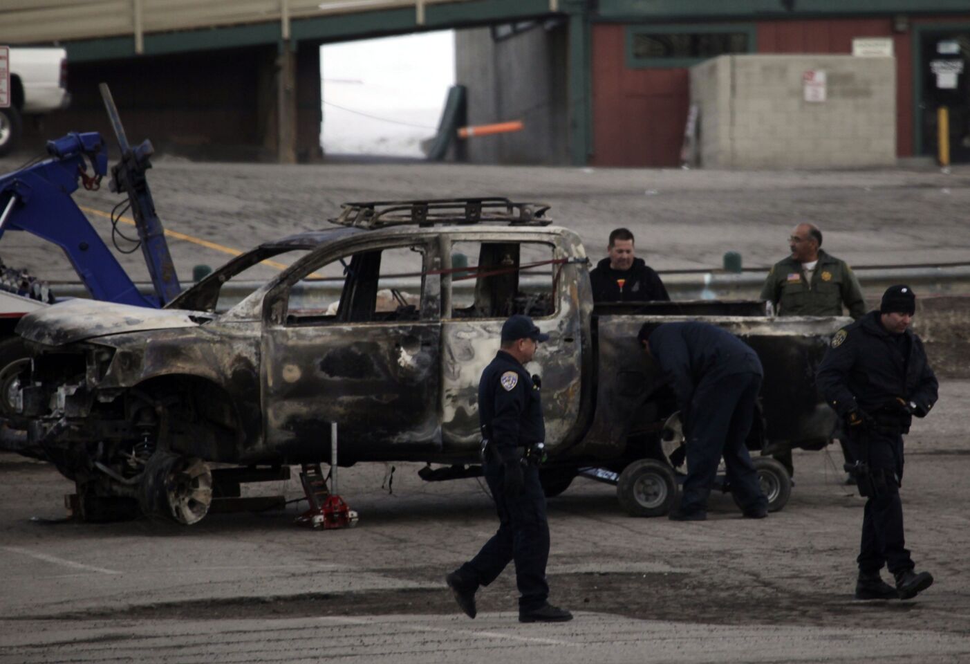 Law enforcement officials found the burned-out truck that police believe shooting suspect Christopher Jordan Dorner used to leave the scene of a killing in Riverside. The truck was found on a forestry road near the Bear Mountain ski area.