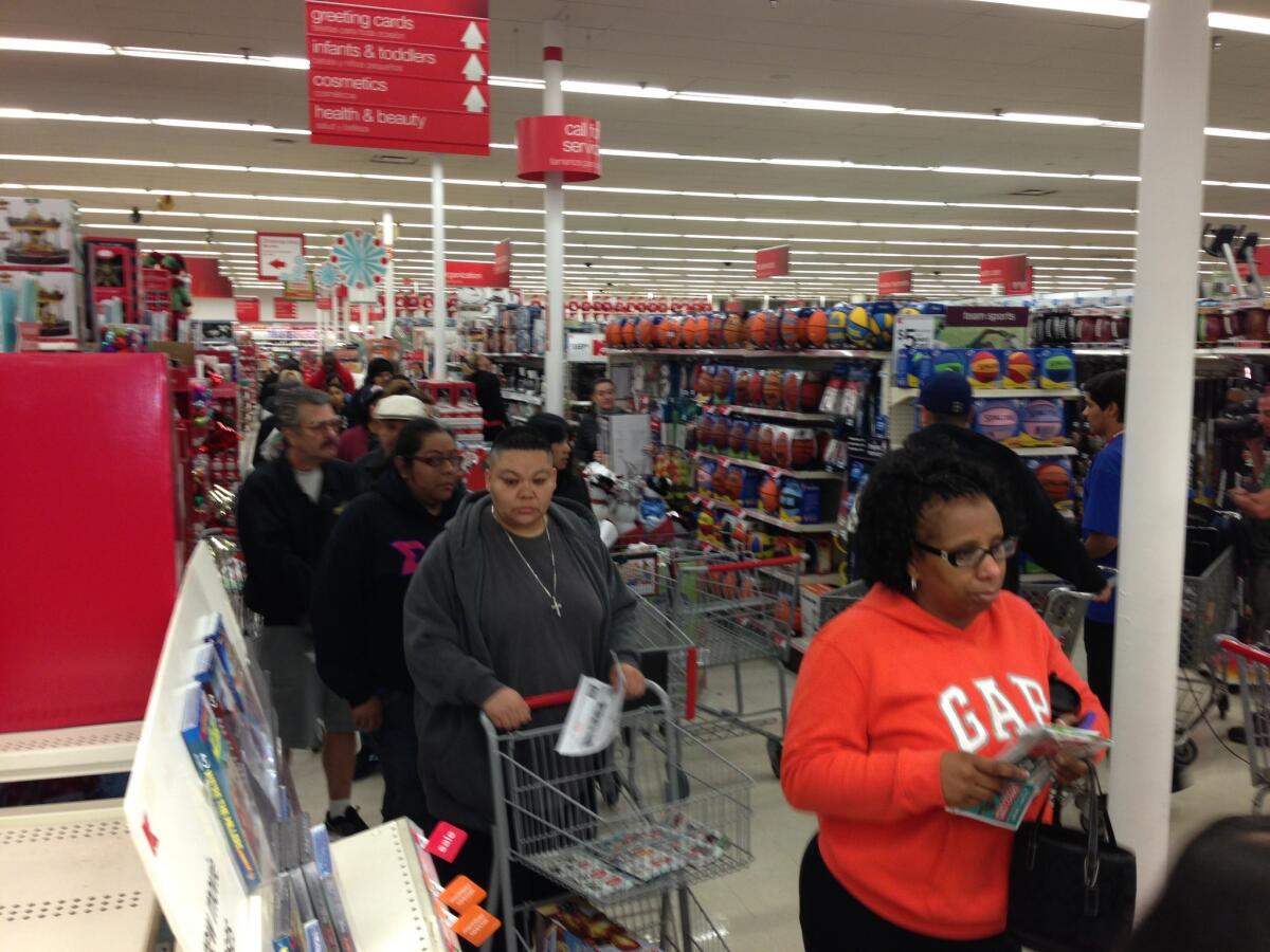 Shoppers wait in line for electronics at a Kmart store in Burbank early Thanksgiving morning.