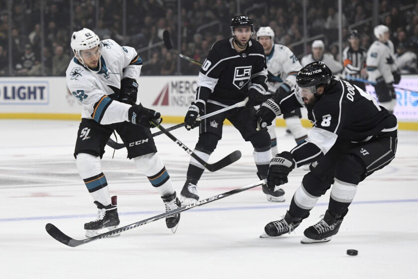 Sharks right wing Kevin Labanc puts a shot on net in front of Kings defenseman Drew Doughty during a game Nov. 25 at Staples Center.