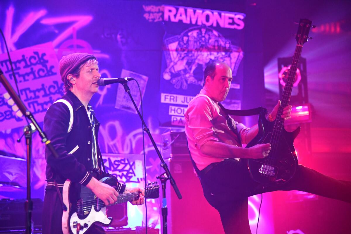 Beck, left, and Krist Novoselic of Nirvana perform Saturday night at the Hollywood Palladium.