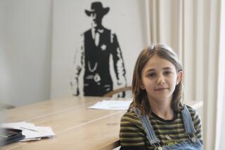 Ola Kozak, 11, sits at the table where she used to do her homework at the family home in Warsaw, Poland, Friday April 5, 2024. Ola is happy that Poland's government has ordered strict limits on the amount of homework that teachers can impose on the lower grades, starting in April. Julian enjoyed doing his homework. (AP Photo/Czarek Sokolowski)