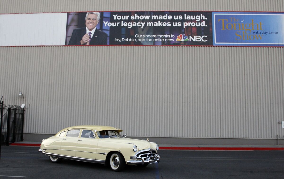Jay Leno arrives at the "Tonight Show" studios in a Hudson Hornet on Jan. 28, 2014, in Burbank. Leno has hosted the show from 1992 to 2009 and began his second tenure on March 1, 2010, and will end as host of the show on Feb. 6, 2014, ending 22 years as a talk show host.