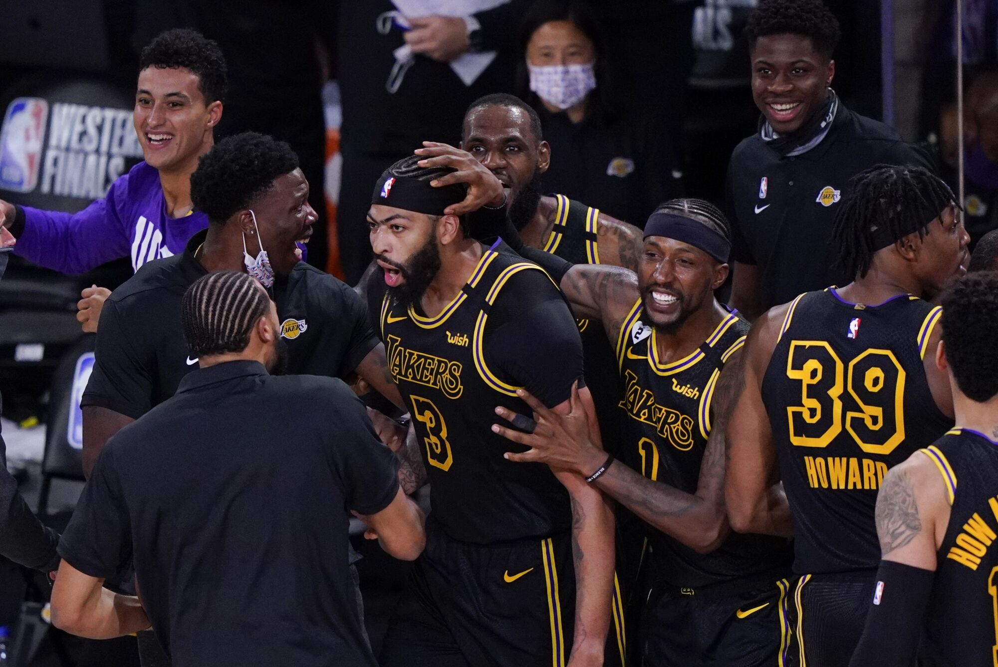 Los Angeles Lakers' Anthony Davis (3) celebrates with teammates after an NBA conference final playoff basketball game.