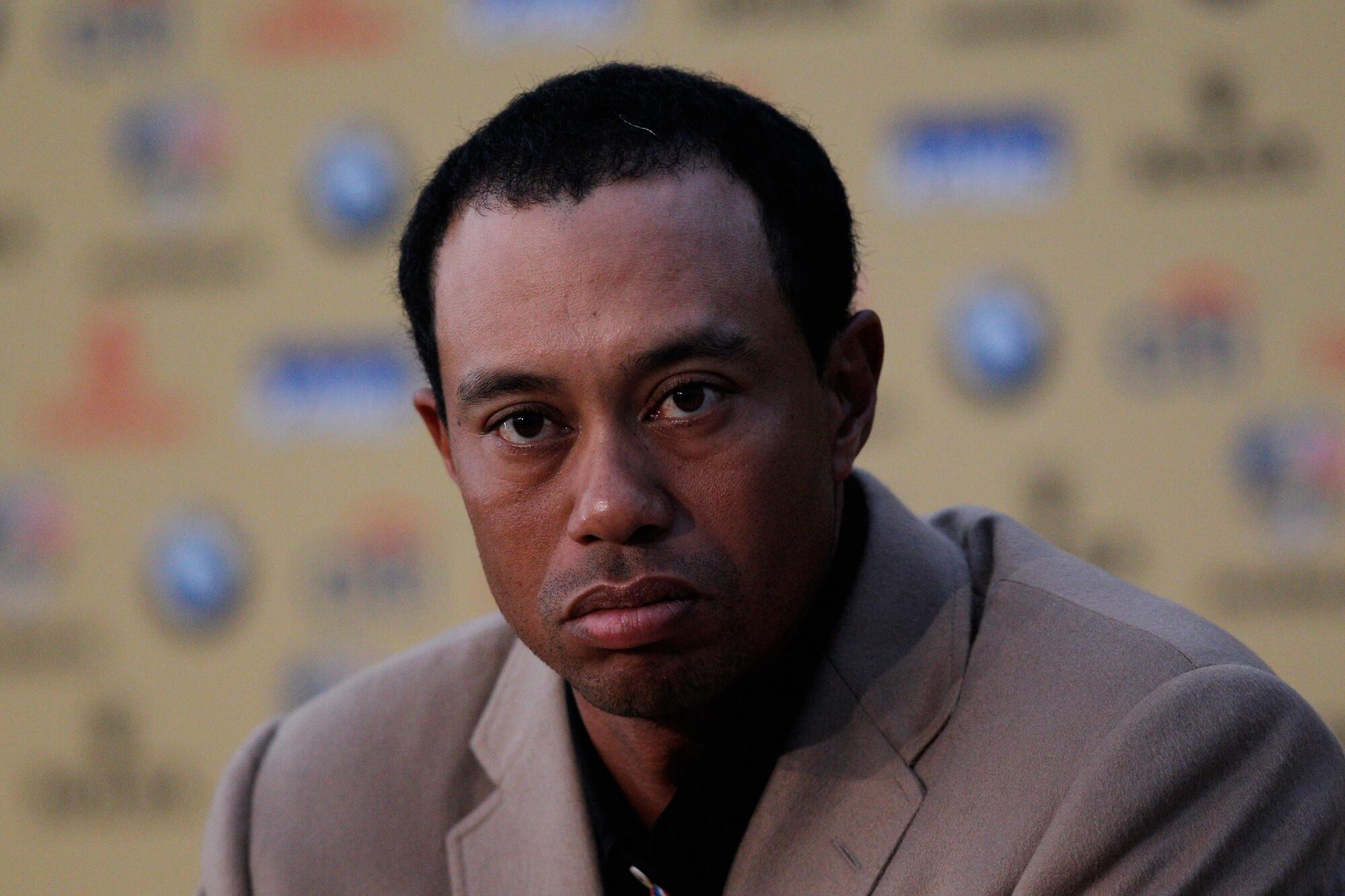 American Tiger Woods attends a tense press conference after Europe's victory over the United States in the 2010 Rider Cup.