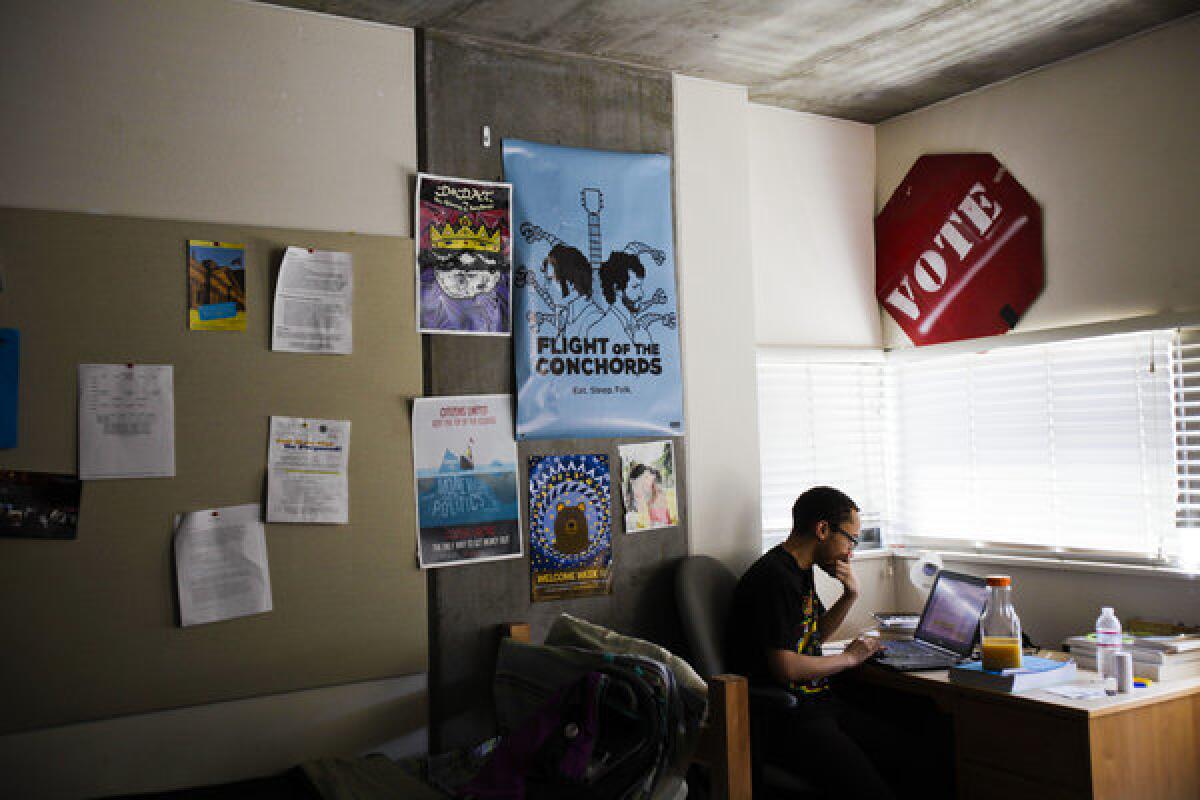 Spencer Simpson spends time studying in his dorm room before class. Simpson grew up in Inglewood and attended Inglewood High.