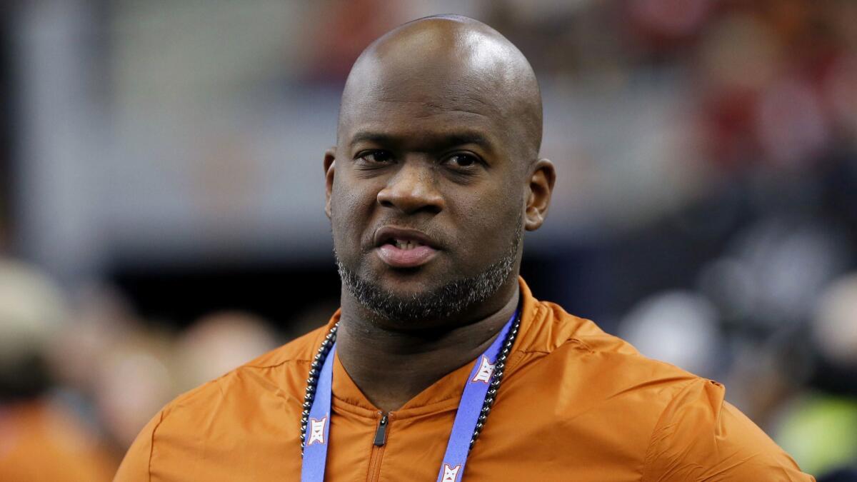 Texas has fired former star quarterback Vince Young from his part-time role as a development officer for poor performance and often being absent from work or not in touch with his supervisors.