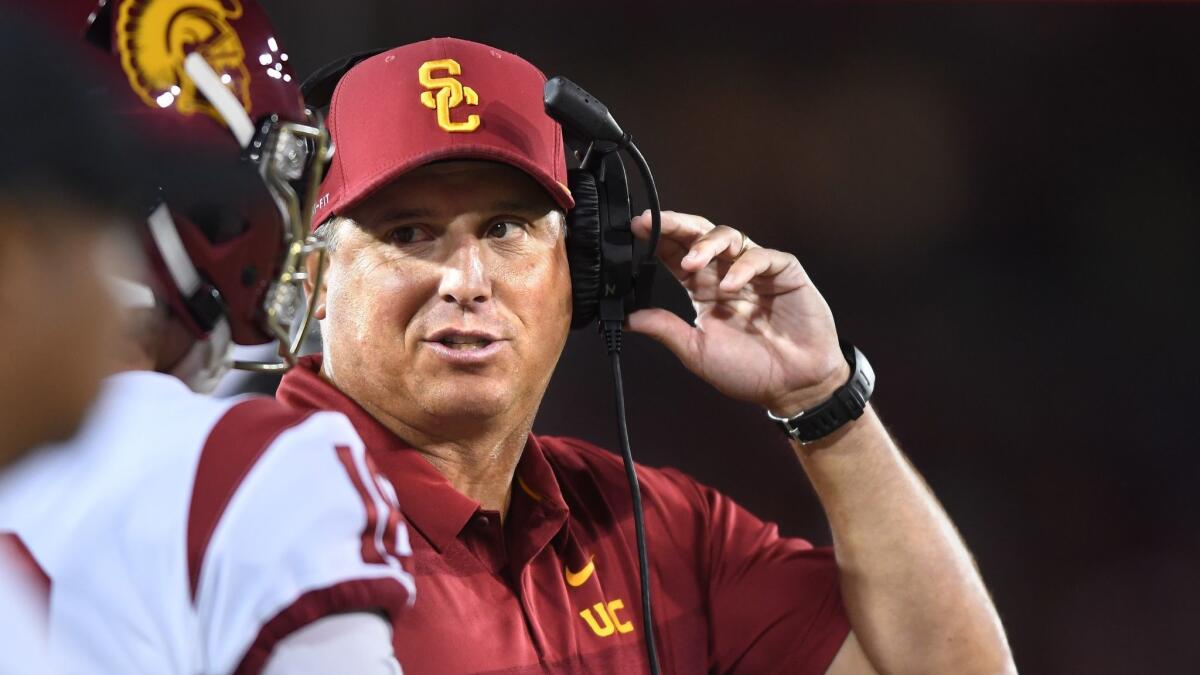 USC coach Clay Helton speaks to one of his players during a game against Stanford in September.