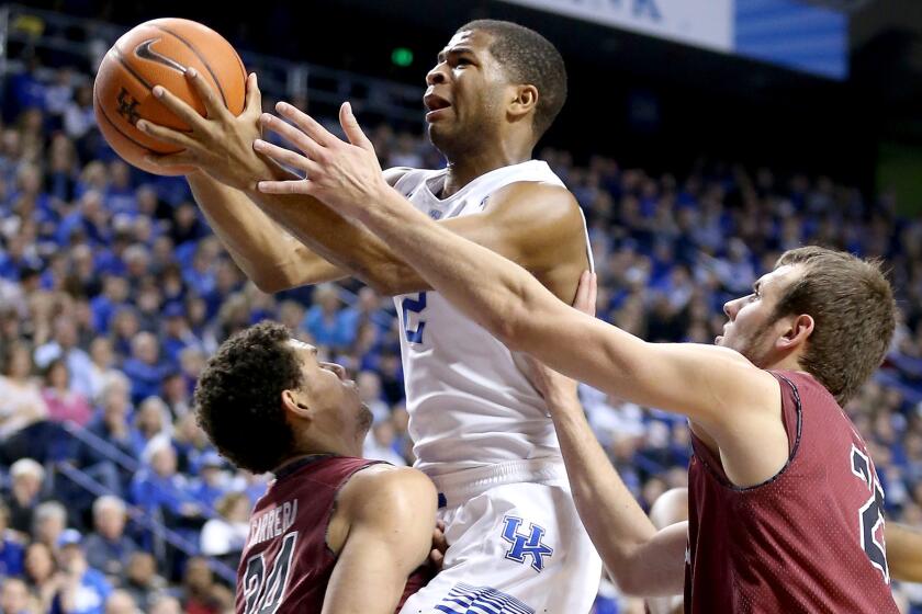 Kentucky guard Aaron Harrison drives to the basket against South Carolina on Saturday.
