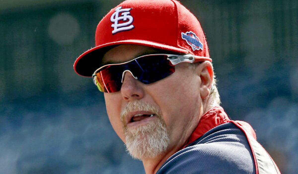 Mark McGwire, formerly with the Cardinals, will now try to awaken Dodgers bats.