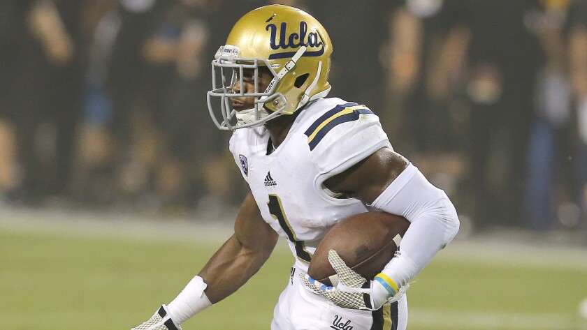 UCLA defensive back Ishmael Adams carries the ball during the Bruins' win over Arizona State on Thursday.