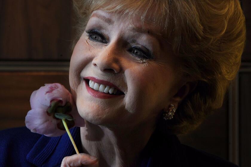 Debbie Reynolds poses during a press conference in London in 2010.