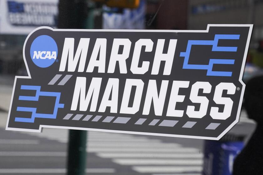 A March Madness sticker for the NCAA college basketball tournament is placed on a window.