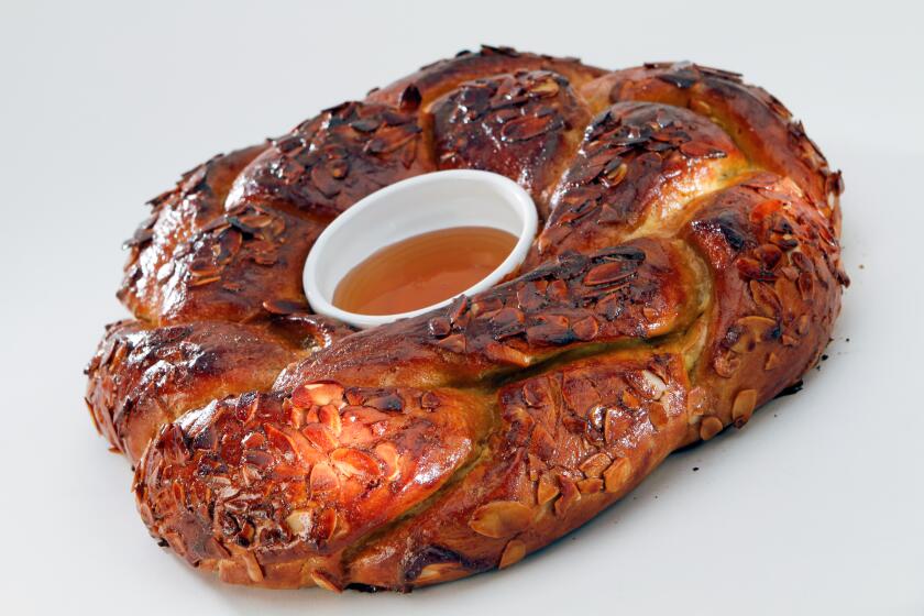 Honey Challah bread on a grey background.