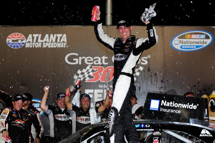 Kevin Harvick celebrates after winning the NASCAR Nationwide Series Great Clips 300 at Atlanta Motor Speedway on Aug. 30.