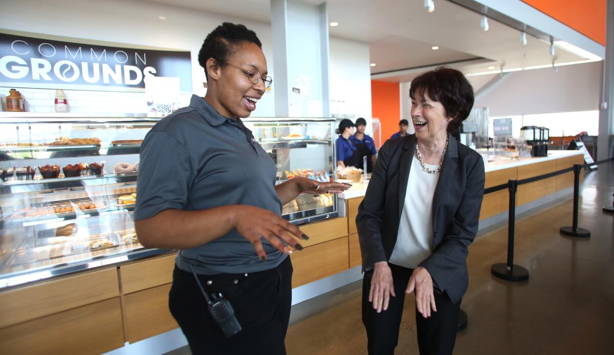 Student manager Ashley Jackson meets with UC Merced Chancellor Dorothy Leland as she tours the new dining hall.