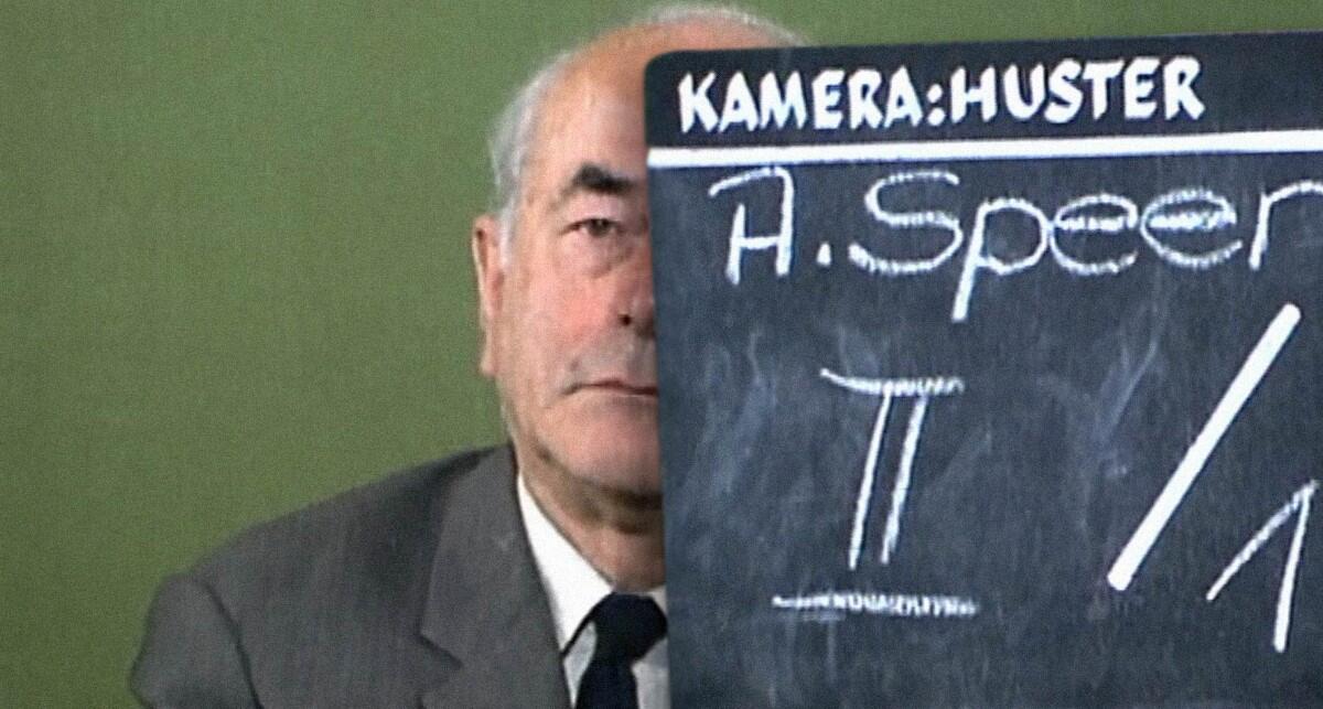 Albert Speer sits half hidden by a chalkboard in the documentary “Speer Goes to Hollywood.”
