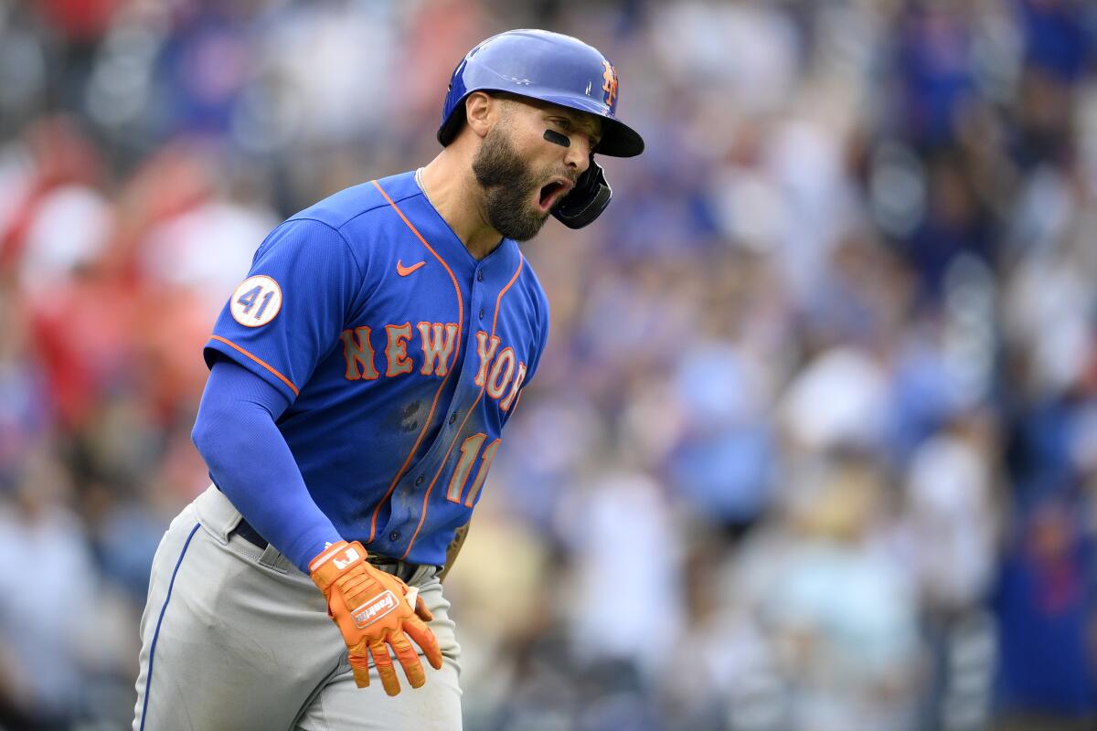 New York Mets' Kevin Pillar reacts after he hit a grand slam during the ninth inning of a baseball game against the Washington Nationals, Sunday, Sept. 5, 2021, in Washington. (AP Photo/Nick Wass)