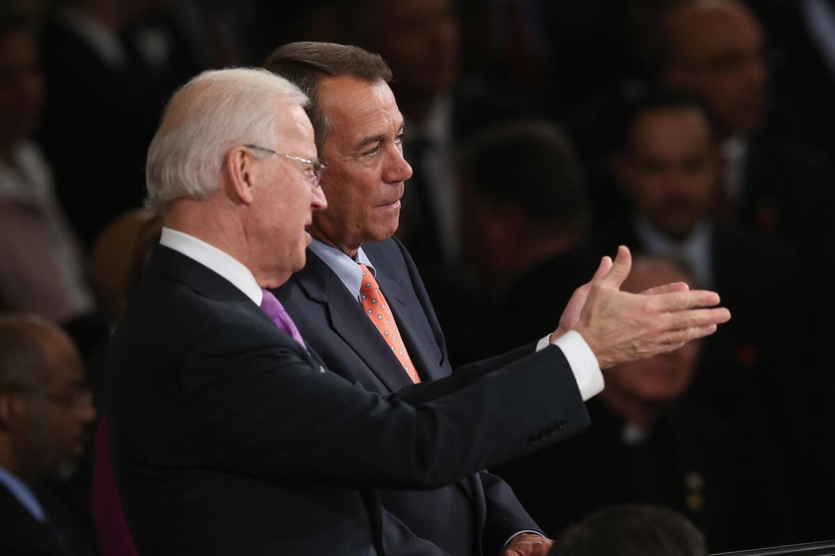 Vice President Biden talks with Speaker of the House Boehner before President Barack Obama's State of the Union address.